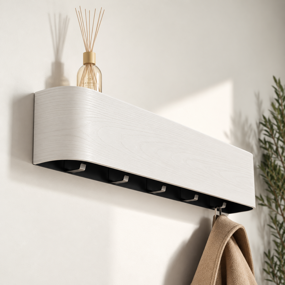 Concealed Hook Wall Coat Rack with Shelf in white finish, close angle with a reed diffuser on the shelf and a coat hanging from a hook below — Wood Store NZ