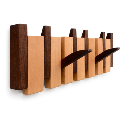 Walnut and beech Piano Hook rack seen from an angle with two hooks folded down. Wood Store NZ