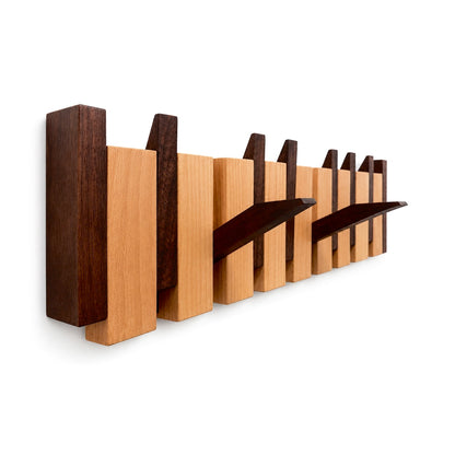 Walnut and beech Piano Hook rack with three hooks folded down, shown against white. Wood Store NZ