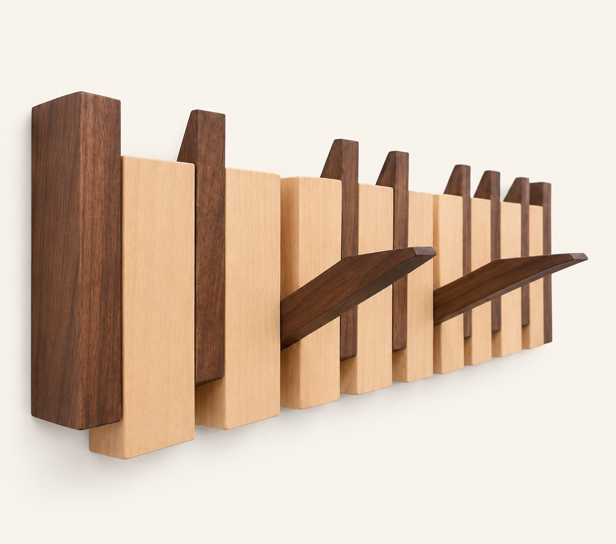 Walnut and beech Piano Hook rack from an angle, two hooks folded down — Wood Store NZ