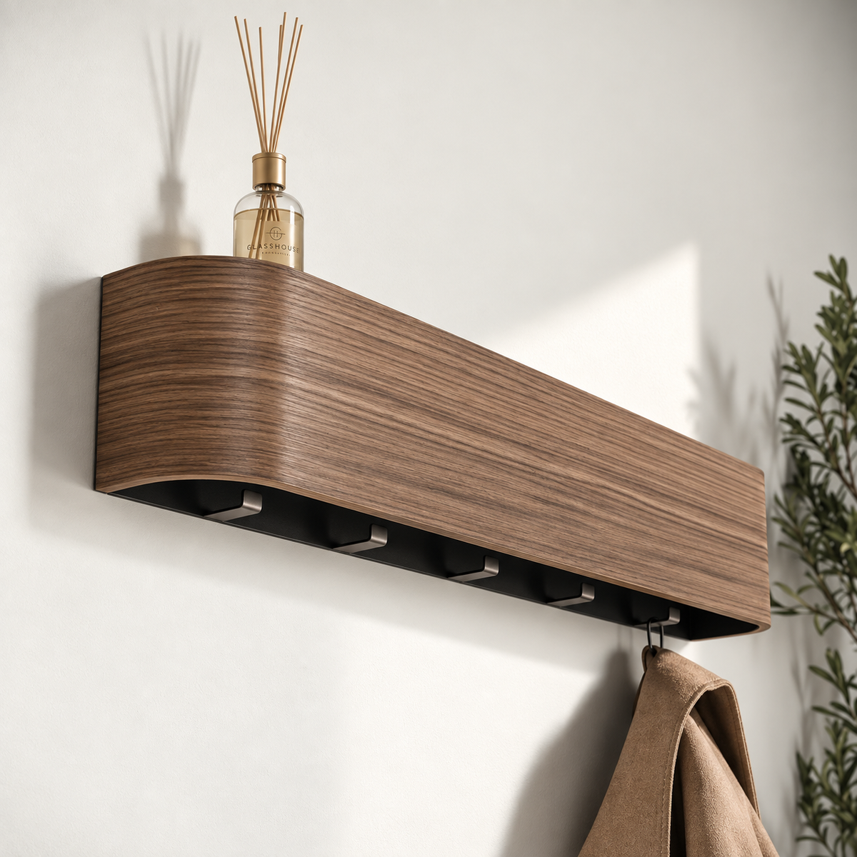 Concealed Hook Wall Coat Rack with Shelf in walnut finish, close angle with a reed diffuser on the shelf and a coat hanging from a hook below — Wood Store NZ
