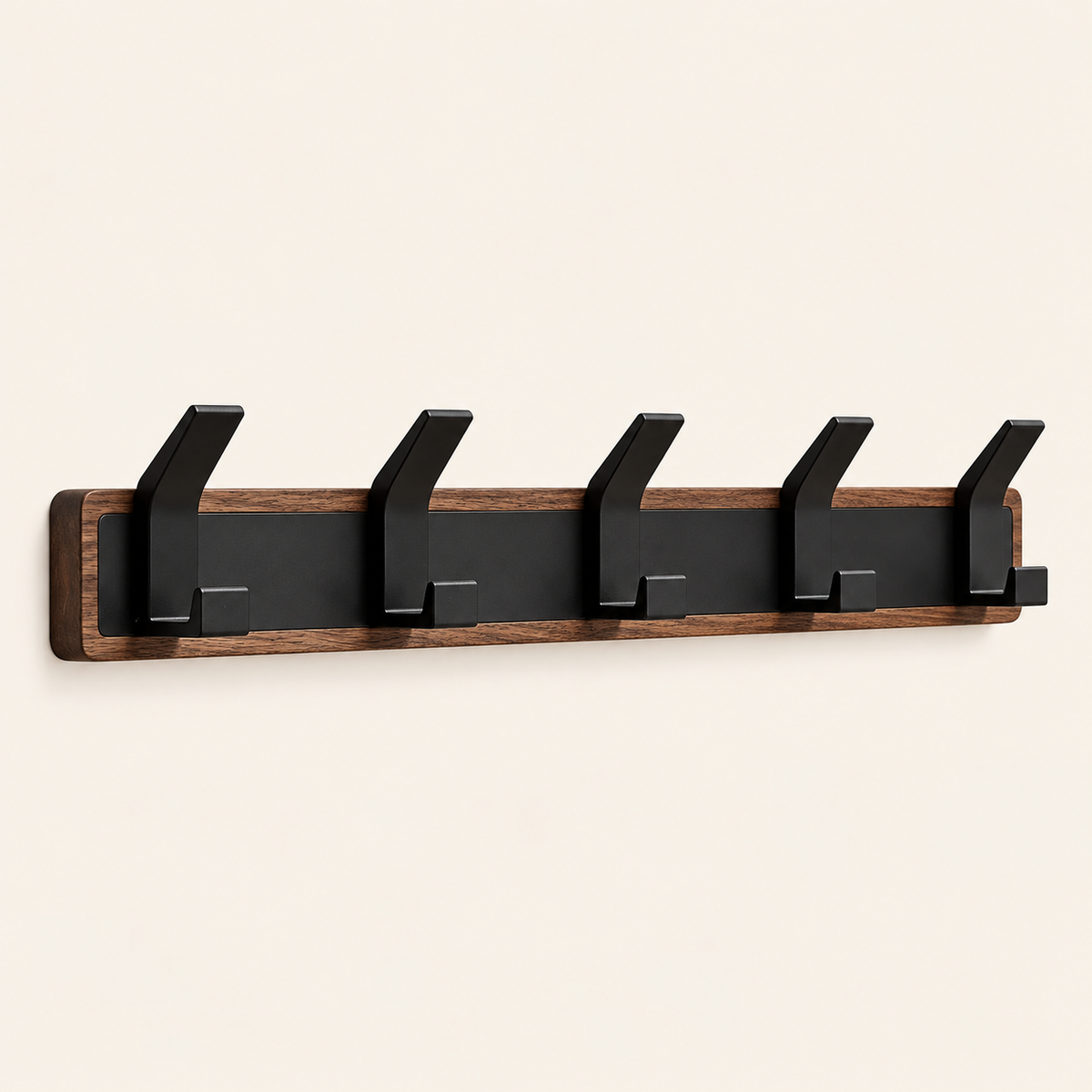 Whare Dual Hook coat rack in walnut and beech, five angled black hooks mounted on a wall — Wood Store NZ