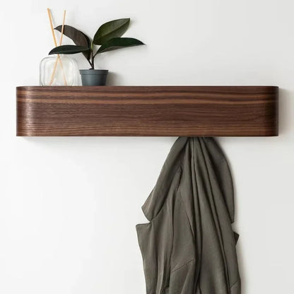 Wall rack with hidden hooks pulled down for use