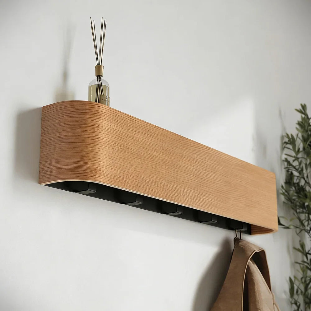 Concealed hook wall rack mounted in a narrow hallway