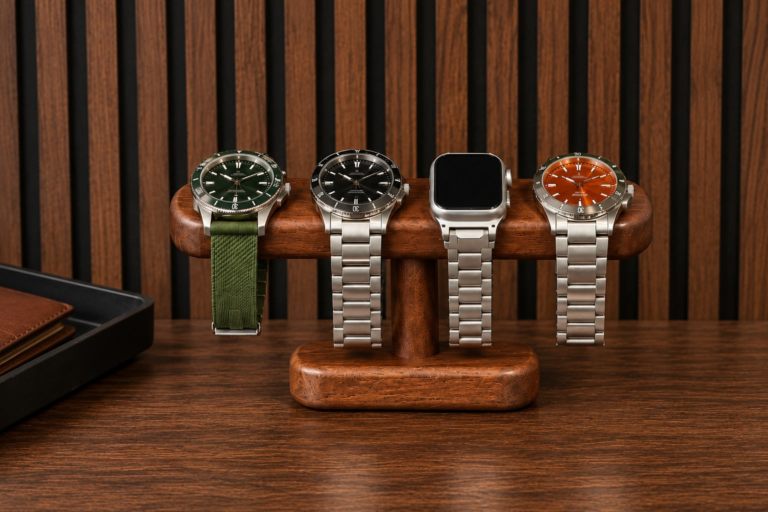 Four watches displayed on a solid timber T-bar stand