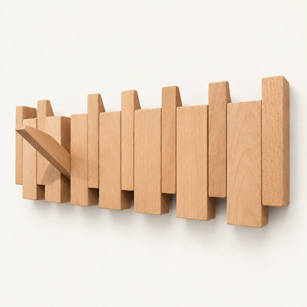 The Piano Hook in Natural Beech, 6 hooks, shown from an angle with one hook folded down — Wood Store NZ