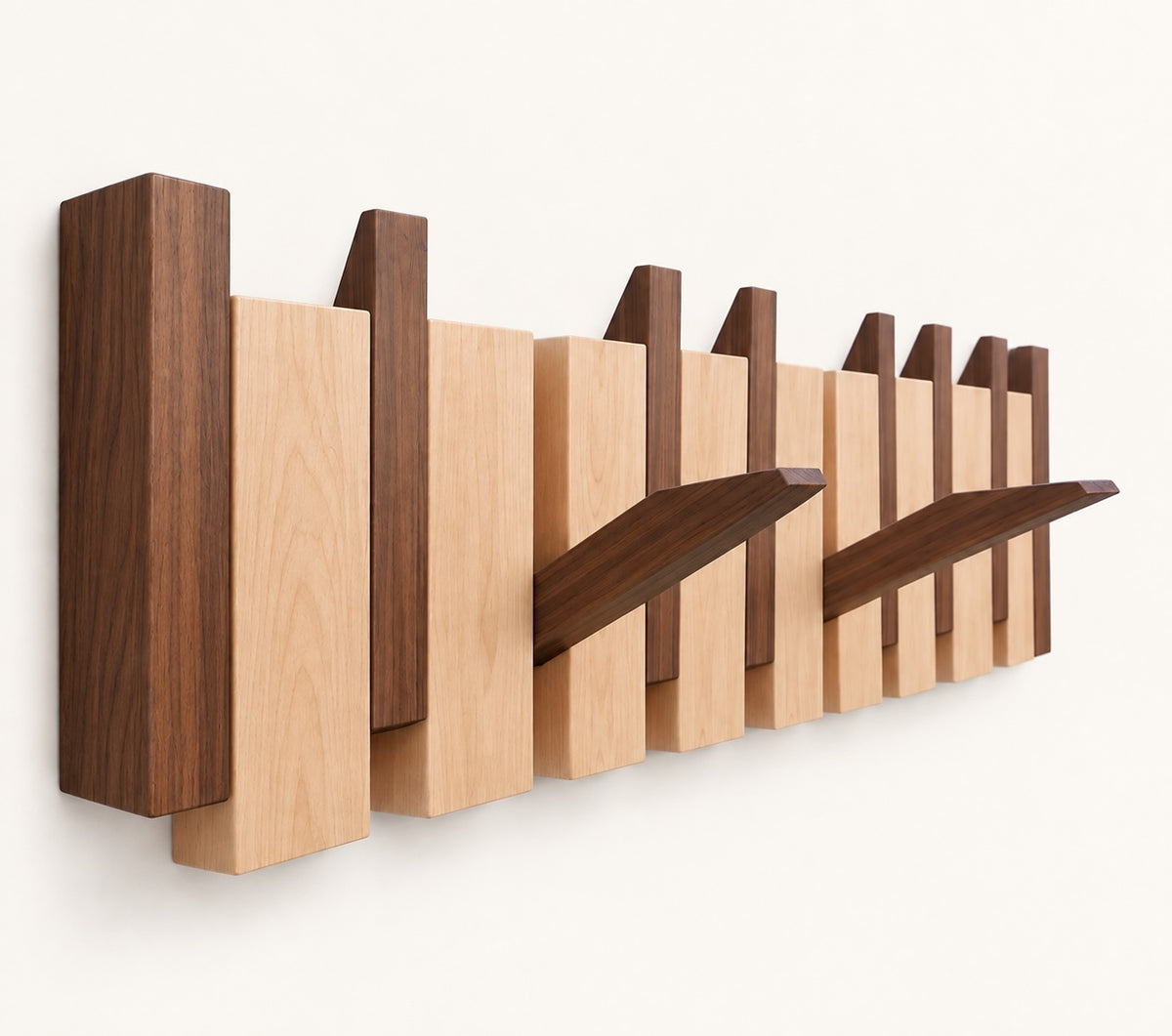 The Piano Hook in Walnut & Beech Mix, 8 hooks, shown from an angle with two hooks folded down — Wood Store NZ